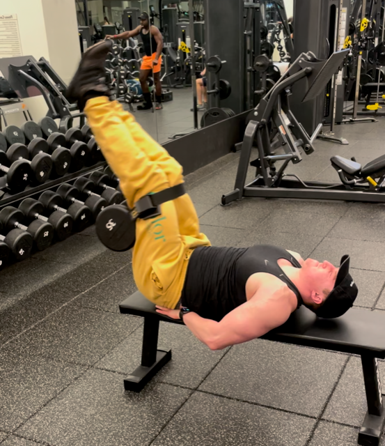 Wilder doing 35-pound, double-legged, leg raises in the gym.